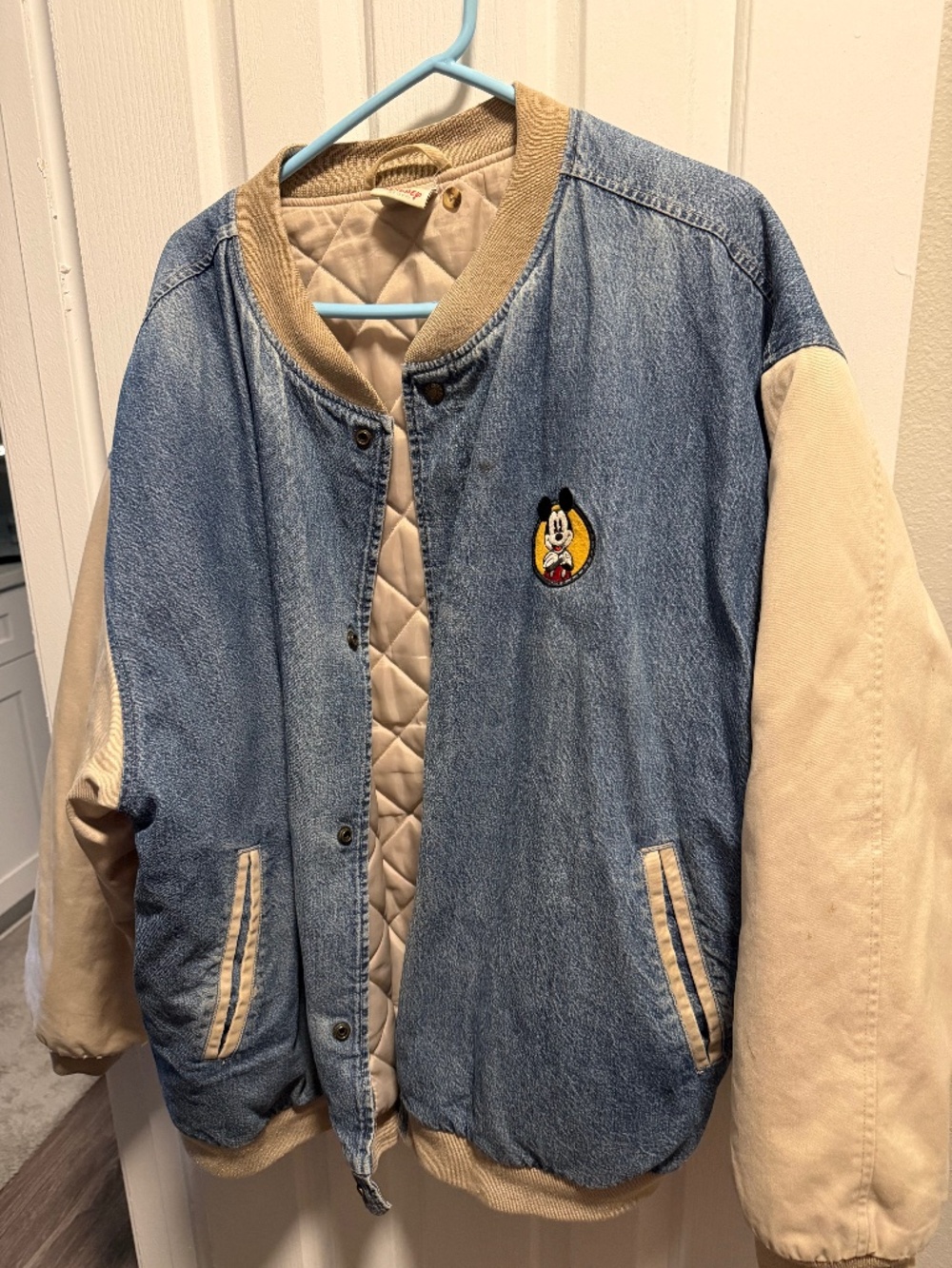 Disney jacket blue with tan sleeves I believe a 2xl